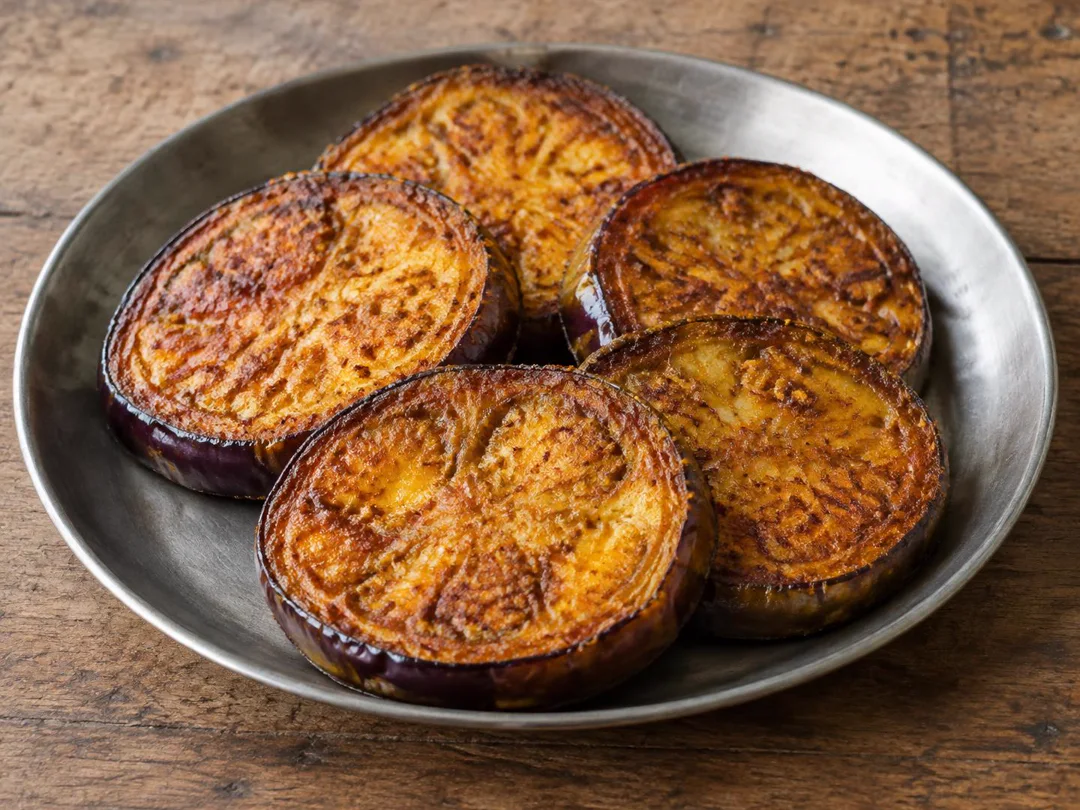 Begun Bhaja — Bengali begun bhaja with broad spice-crusted fried brinjal slices