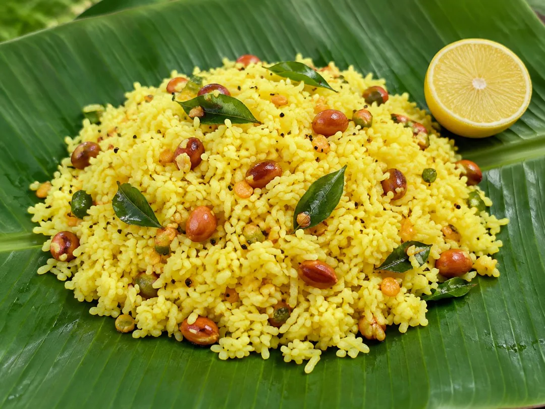 Banana Leaf Lemon Rice — Turmeric lemon rice with peanuts, urad dal and curry leaves served on a banana leaf