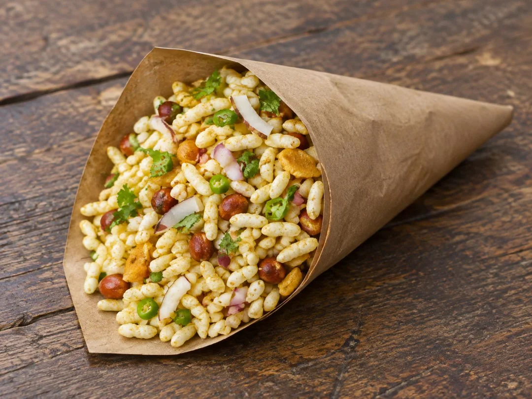 Jhal Muri — Dry Bengali jhal muri with puffed rice, coconut, peanuts and green chilli in a paper cone