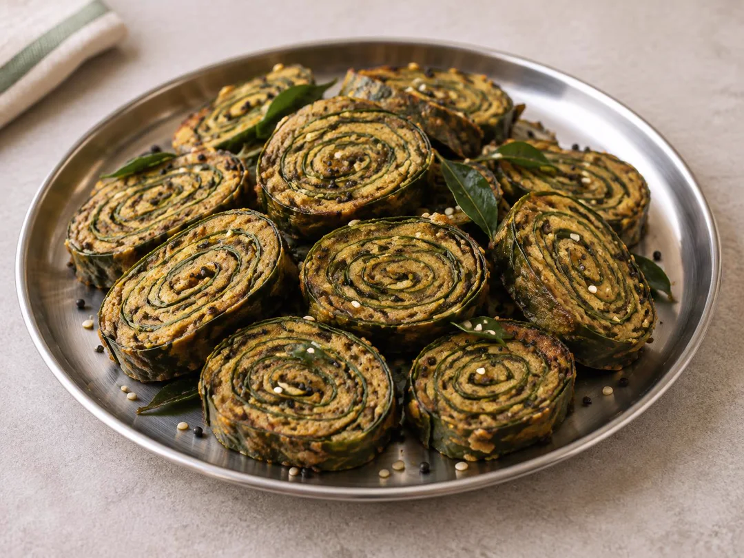 Patra (Alu Vadi) — Sliced Gujarati patra showing spiral colocasia leaf and gram flour layers